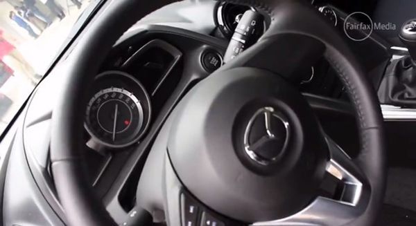 https://img.icarcdn.com/autospinn/body/2015-mazda-2-interior-revealed-in-a-video-4.jpg